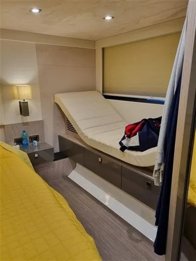  Yacht Photos Pics Interior of 2019 Cranchi 60HT yacht with modern furnishings and cozy lighting.