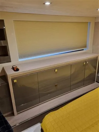  Yacht Photos Pics Interior of 2019 Cranchi 60HT yacht with modern cabinetry and window blind.