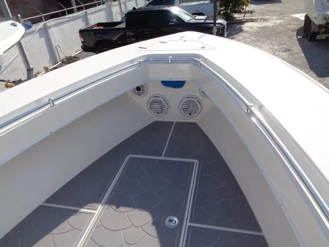  Yacht Photos Pics 2022 Contender 32 ST boat interior with speakers and storage compartments.