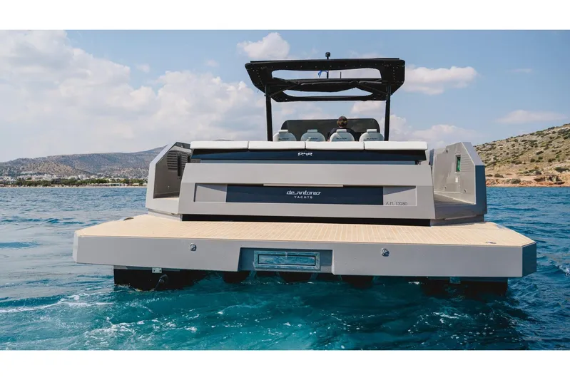  Yacht Photos Pics 2023 De Antonio Yachts D42 Open on water, rear view, sleek design, sunny day.