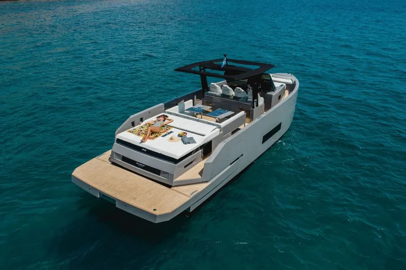  Yacht Photos Pics 2023 De Antonio Yachts D42 Open cruising on clear blue water.