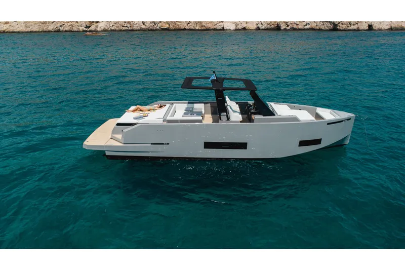  Yacht Photos Pics 2023 De Antonio Yachts D42 Open cruising on clear blue water.