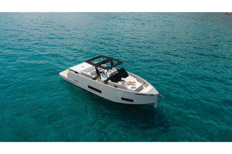  Yacht Photos Pics 2023 De Antonio Yachts D42 Open cruising on clear blue water.