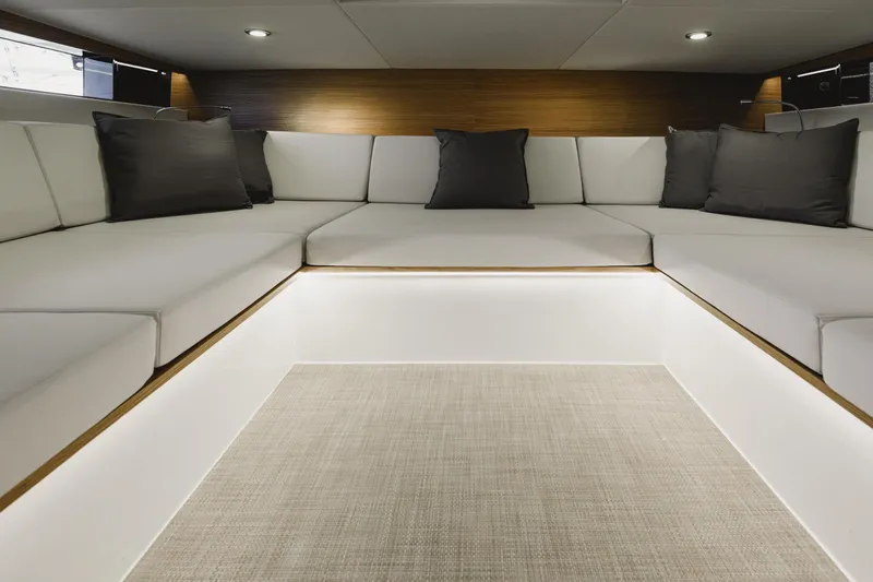  Yacht Photos Pics Luxurious interior of 2023 De Antonio Yachts D42 Open with elegant seating and ambient lighting.