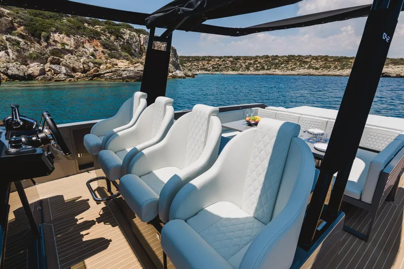  Yacht Photos Pics Luxurious 2023 De Antonio Yachts D42 Open with elegant seating, cruising in scenic waters.