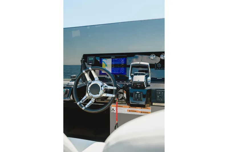  Yacht Photos Pics Helm of 2023 De Antonio Yachts D42 Open with modern navigation controls.