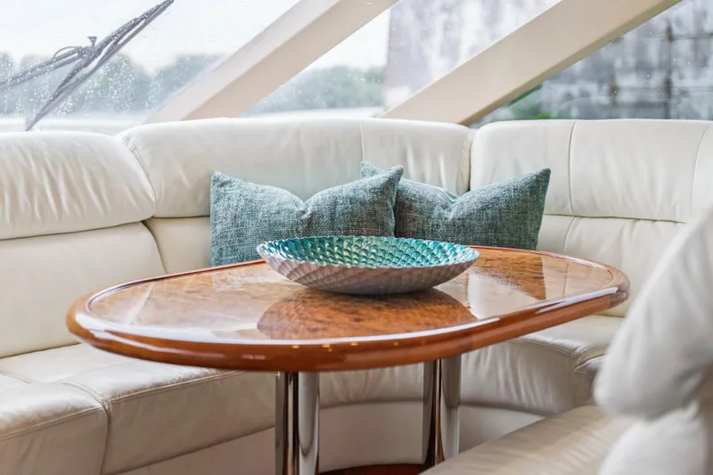 Day To Day Yacht Photos Pics Luxurious Neptunus 62 Flybridge 2008 yacht interior with elegant table and plush seating.