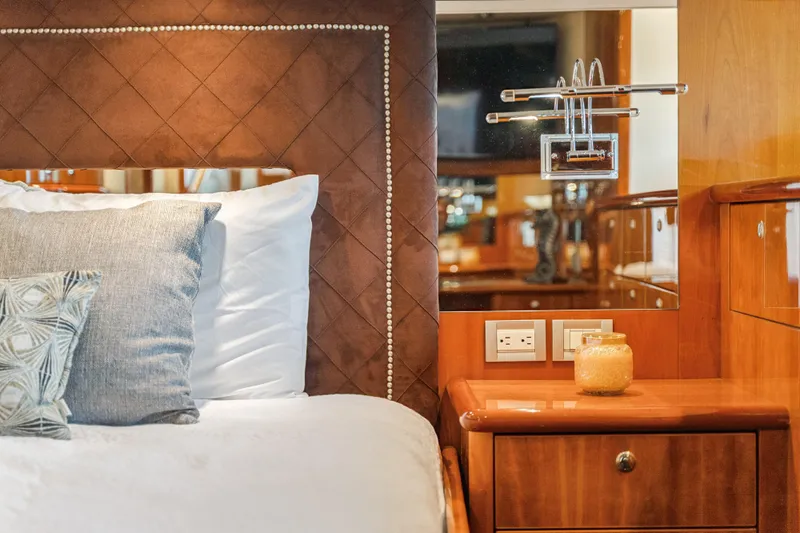 Day To Day Yacht Photos Pics Luxurious Neptunus 62 Flybridge 2008 yacht bedroom with elegant decor and plush bedding.