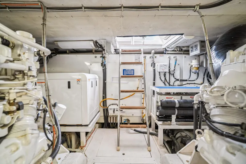 Day To Day Yacht Photos Pics Engine room of 2008 Neptunus 62 Flybridge yacht, featuring machinery and equipment.