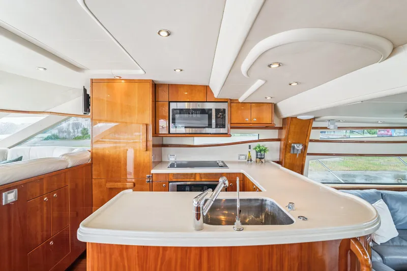 Day To Day Yacht Photos Pics Luxurious kitchen interior of 2008 Neptunus 62 Flybridge yacht with modern amenities.