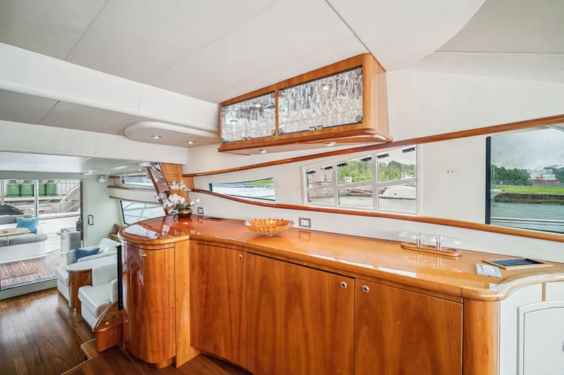 Day To Day Yacht Photos Pics Luxurious interior of 2008 Neptunus 62 Flybridge yacht with elegant wood cabinetry.