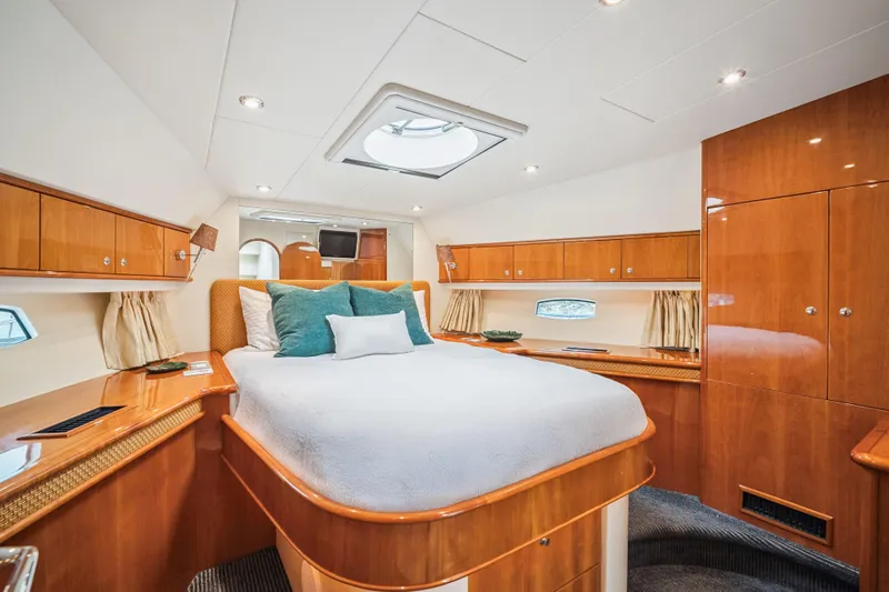 Day To Day Yacht Photos Pics Luxurious cabin interior of 2008 Neptunus 62 Flybridge yacht with elegant wood finishes.
