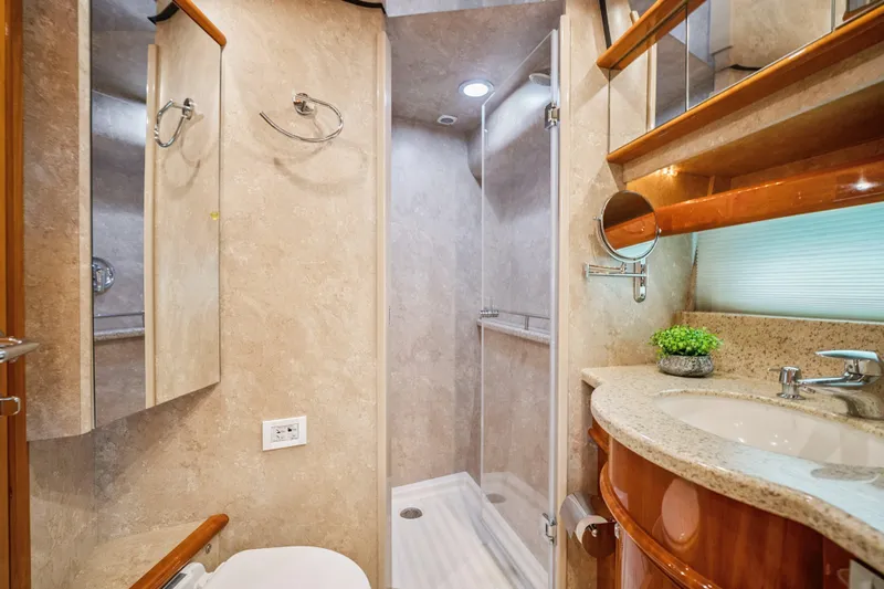 Day To Day Yacht Photos Pics Luxurious bathroom in 2008 Neptunus 62 Flybridge yacht with elegant fixtures and modern design.