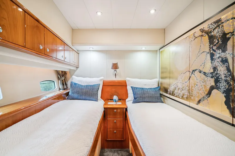 Day To Day Yacht Photos Pics Luxurious 2008 Neptunus 62 Flybridge yacht cabin with twin beds and elegant decor.