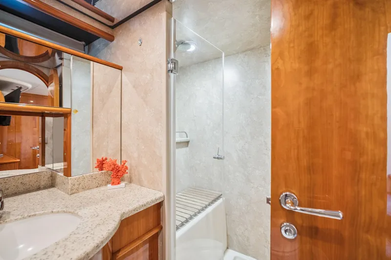 Day To Day Yacht Photos Pics Luxurious bathroom in 2008 Neptunus 62 Flybridge yacht with elegant wood and marble finishes.