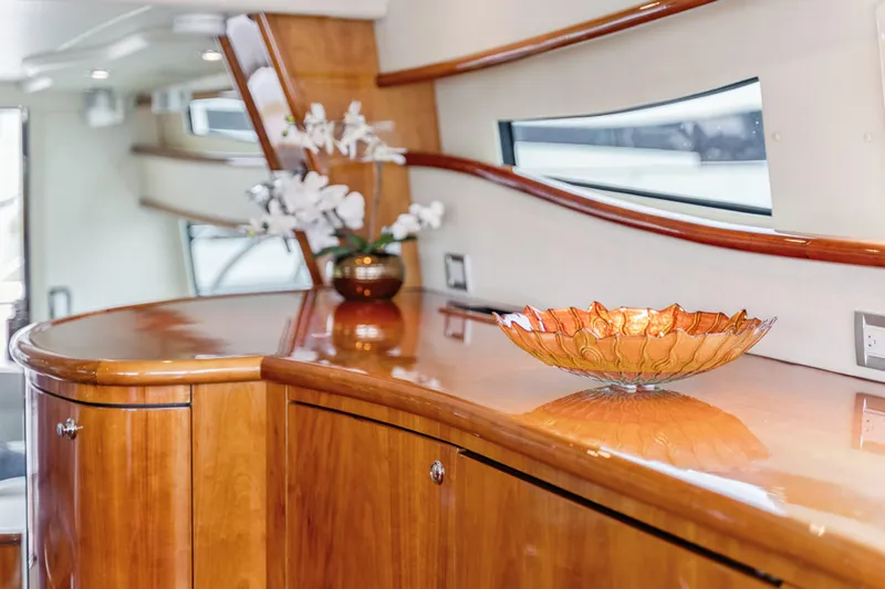 Day To Day Yacht Photos Pics Luxurious interior of 2008 Neptunus 62 Flybridge yacht with elegant wood finish and decor.