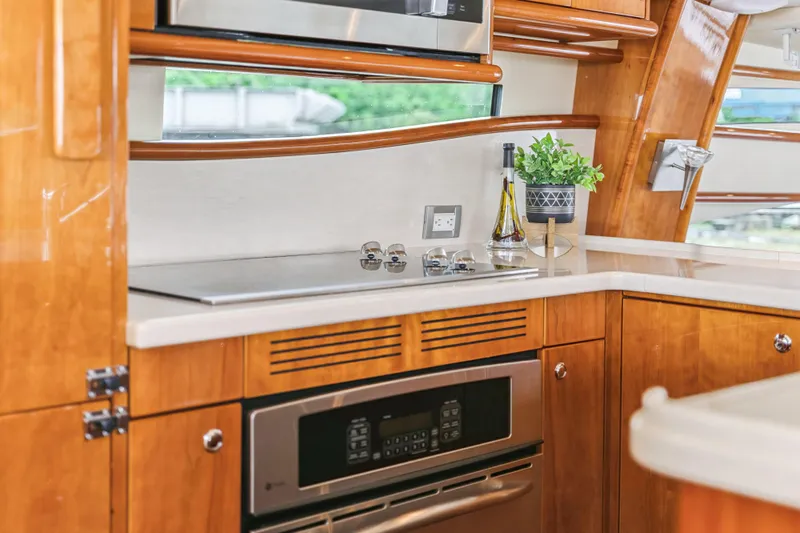 Day To Day Yacht Photos Pics Luxurious kitchen interior of 2008 Neptunus 62 Flybridge yacht with modern appliances.