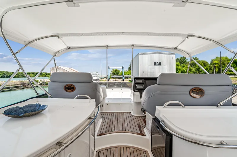 Day To Day Yacht Photos Pics 2008 Neptunus 62 Flybridge yacht interior with elegant seating and modern controls.