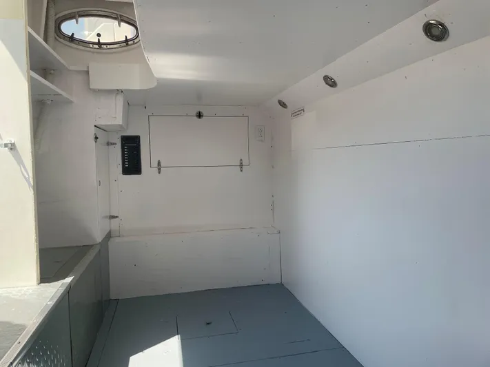 Day To Day Yacht Photos Pics Interior of 2008 Neptunus 62 Flybridge yacht, featuring white walls and circular window.