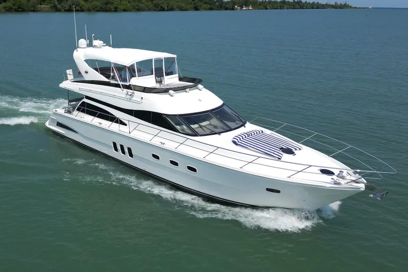 Day To Day Yacht Photos Pics 2008 Neptunus 62 Flybridge yacht cruising on calm blue waters.