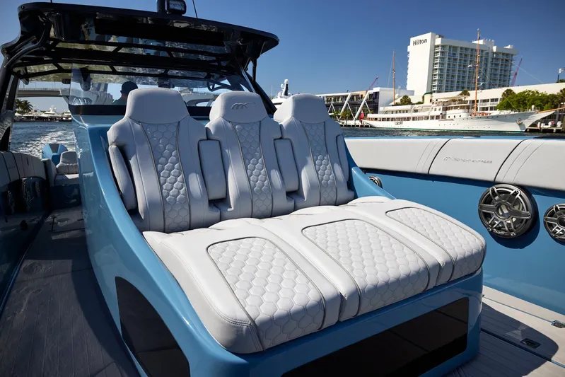  Yacht Photos Pics Luxurious seating on 2023 Midnight Express 43' Open boat, featuring modern design and waterfront view.