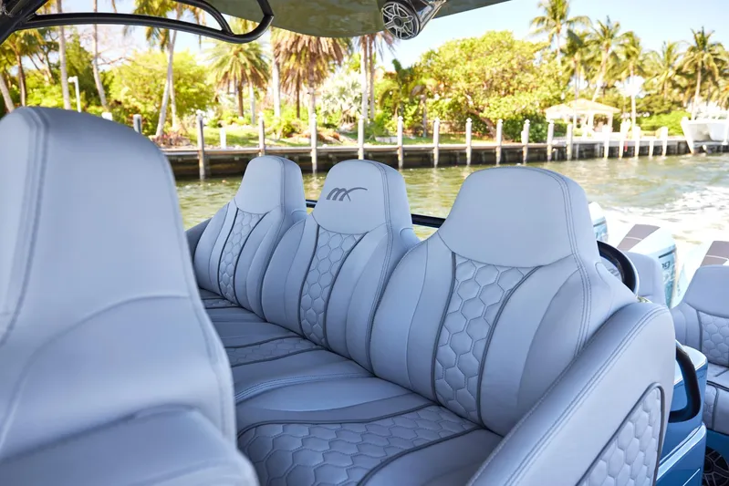  Yacht Photos Pics Luxurious seating on 2023 Midnight Express 43' Open boat, featuring elegant design and waterfront view.