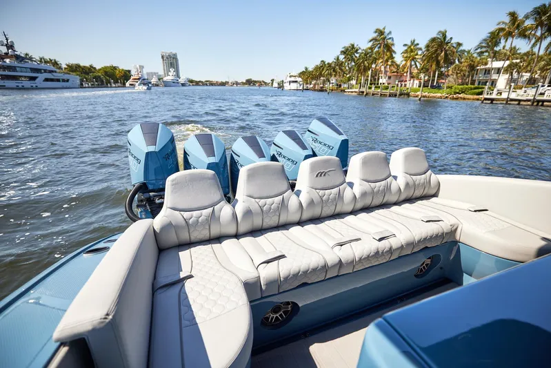  Yacht Photos Pics 2023 Midnight Express 43' Open boat with luxurious seating and powerful engines on a sunny waterway.