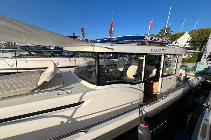  Yacht Photos Pics 2025 Nimbus C11 boat docked, featuring sleek design and modern amenities.