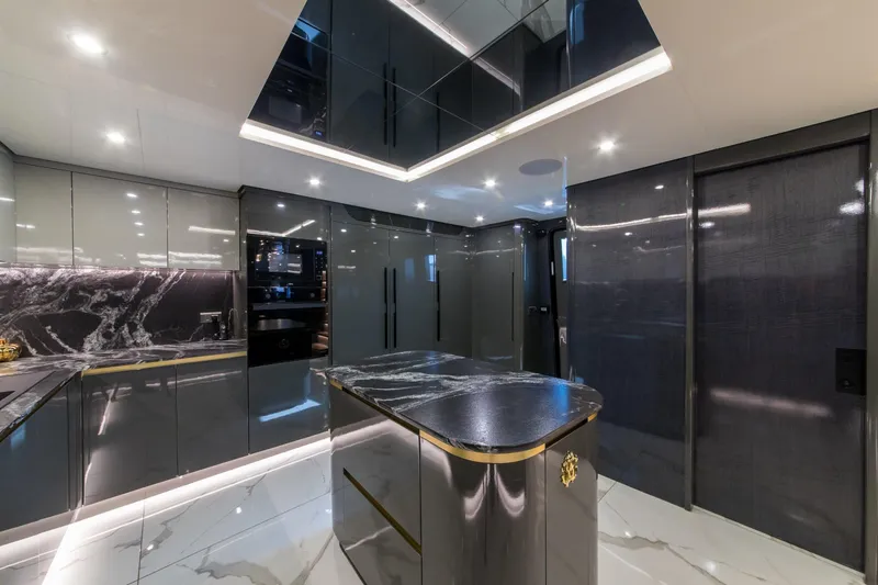 Queen Karina Yacht Photos Pics Luxurious modern kitchen interior on a 2000 Cheoy Lee 92 ft yacht.