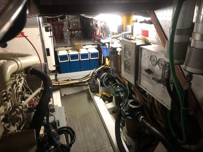 Off The Grid Yacht Photos Pics Engine room of 2001 Selene Ocean Trawler with control panels and equipment.
