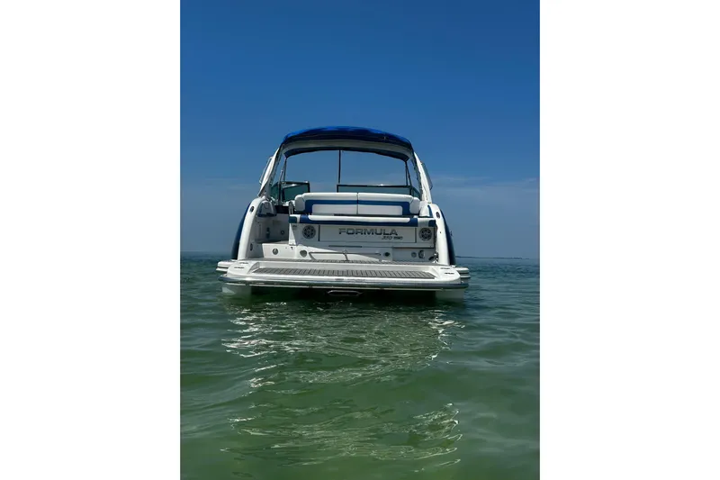  Yacht Photos Pics 2017 Formula 350 Crossover Bowrider OB on calm water, rear view.