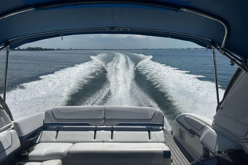  Yacht Photos Pics 2017 Formula 350 Crossover Bowrider OB cruising on open water, view from rear seating.