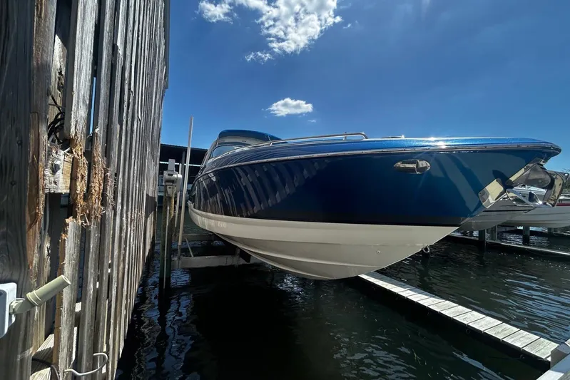  Yacht Photos Pics 2017 Formula 350 Crossover Bowrider OB docked, blue hull, sunny day.