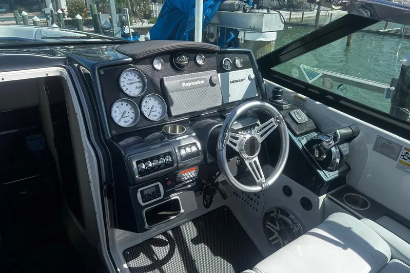  Yacht Photos Pics 2017 Formula 350 Crossover Bowrider OB dashboard with steering wheel and navigation controls.