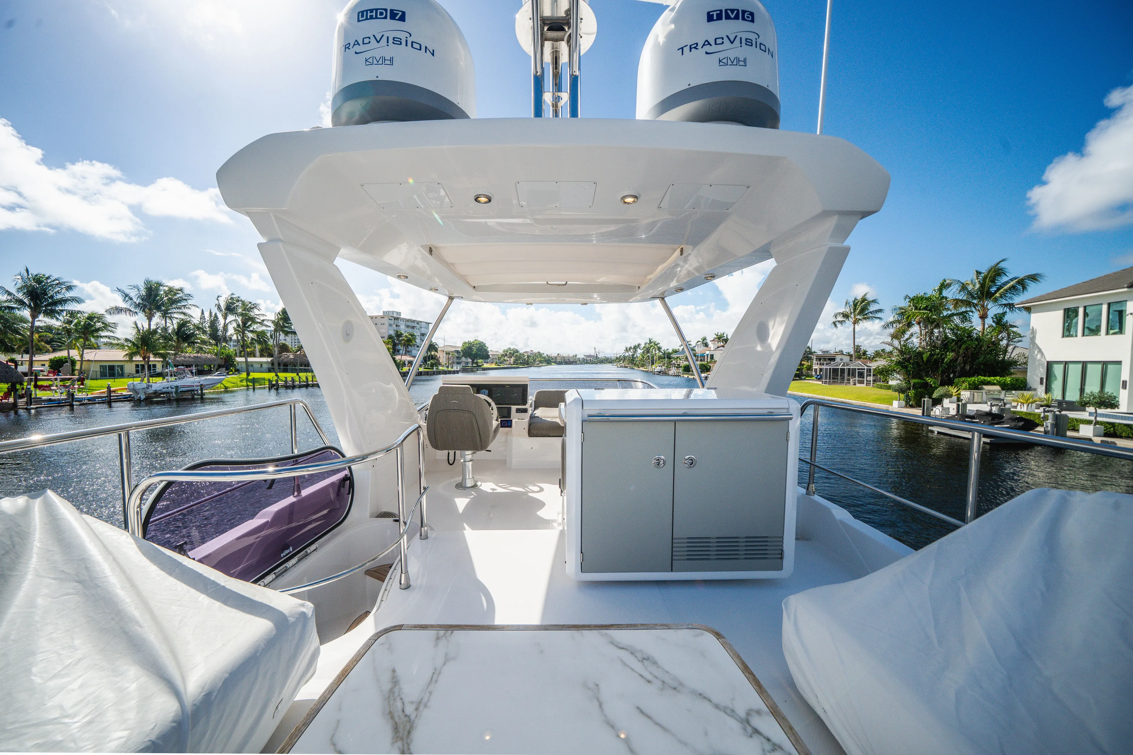  Yacht Photos Pics Luxurious 2022 Azimut 50 Fly yacht interior with modern amenities, cruising on a sunny day.