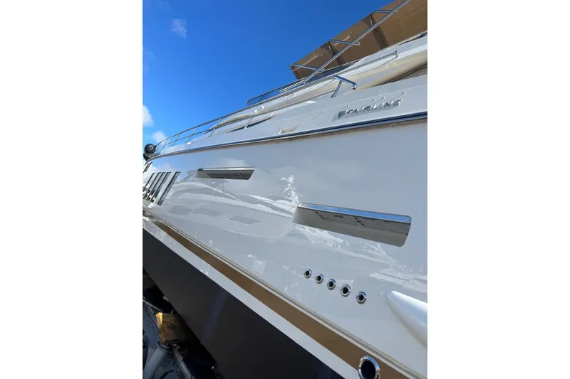  Yacht Photos Pics 2015 Fairline Squadron 65 yacht, sleek exterior design under clear blue sky.