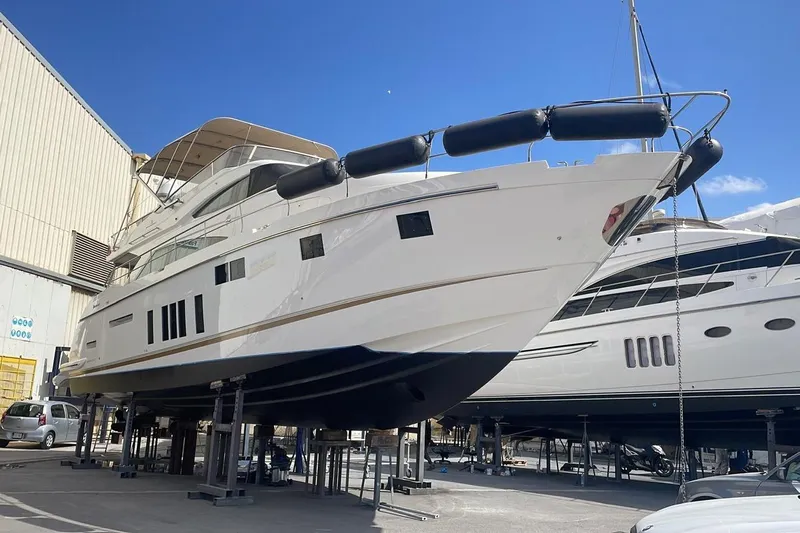  Yacht Photos Pics 2015 Fairline Squadron 65 yacht on dry dock under clear blue sky.