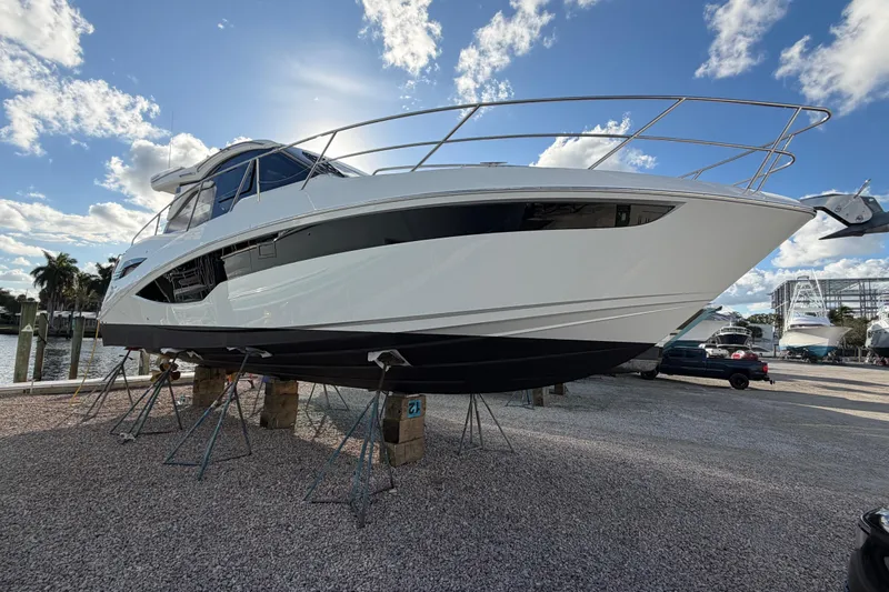  Yacht Photos Pics 2022 Galeon 425 HTS yacht on stands, displayed outdoors under a bright blue sky.