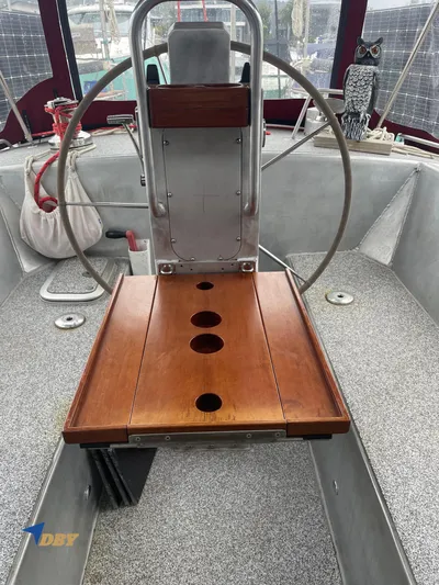 Rubicon Yacht Photos Pics 2022 Radford 15.2 boat cockpit with wooden table and steering wheel.