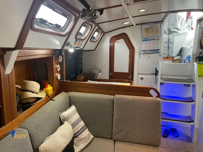 Rubicon Yacht Photos Pics Cozy interior of 2022 Radford 15.2 yacht with seating, stairs, and nautical decor.
