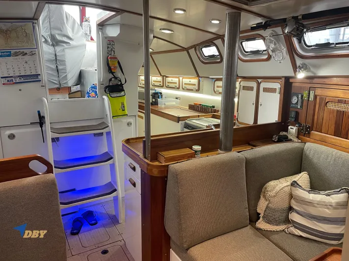 Rubicon Yacht Photos Pics Cozy interior of 2022 Radford 15.2 yacht with modern kitchen and seating area.