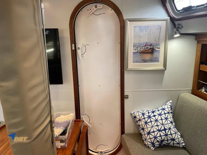 Rubicon Yacht Photos Pics Interior of a 2022 Radford 15.2 yacht with nautical decor and a cozy seating area.