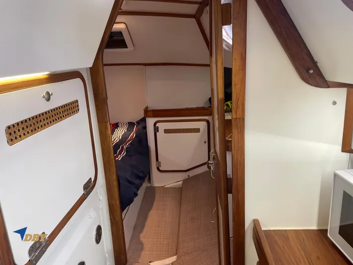 Rubicon Yacht Photos Pics Interior of 2022 Radford 15.2 boat with cozy cabin and wooden accents.