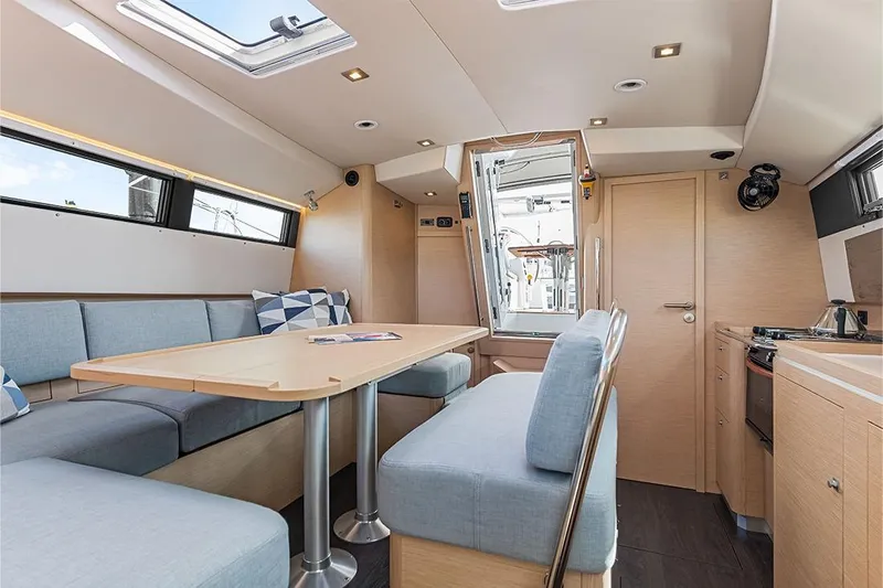  Yacht Photos Pics Modern interior of 2025 Garcia 45 Explorer yacht with light wood and blue upholstery.