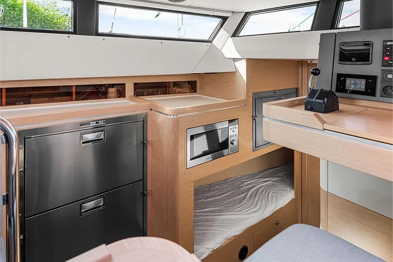  Yacht Photos Pics Interior of 2025 Garcia 45 Explorer yacht with modern kitchen and sleeping area.