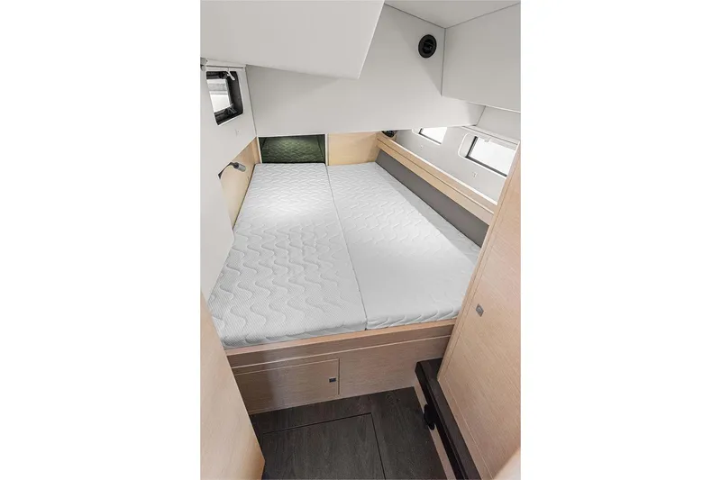 Yacht Photos Pics Cozy cabin interior of 2025 Garcia 45 Explorer yacht with comfortable bedding.