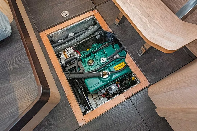  Yacht Photos Pics Engine compartment of 2025 Garcia 45 Explorer yacht, showcasing mechanical components and wooden interior.