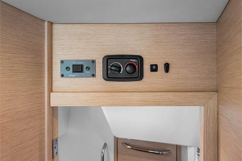  Yacht Photos Pics Control panel inside 2025 Garcia 45 Explorer yacht, featuring various switches and dials.