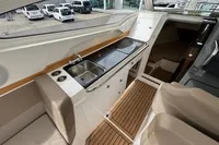 Interior of 2019 Nimbus W 9 boat with compact kitchen and seating area.
