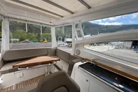Interior of 2019 Nimbus W 9 boat with seating, table, and kitchenette, Lake Constance registration.